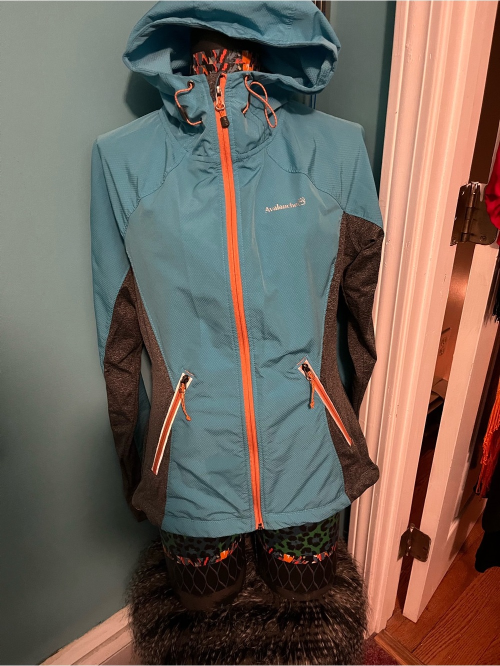 Avalanche Teal Lightweight Jacket with Orange Zipper and Gray Panel